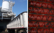 Sludge processing facility with truck receival and vertical lift conveyors