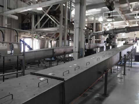 Dried sludge conveyor system 